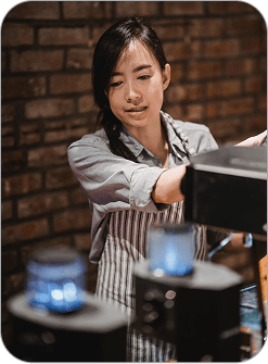 Barista working behind counter