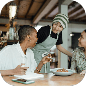 Restaurant interior with service team